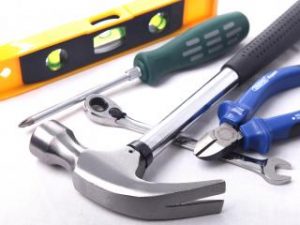 Pile of tools, hammer, level, pliers, screwdriver, wrench