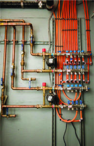 Bronze Piping connecting to Orange Tubes